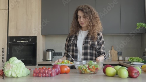 Smiling Woman Enjoying Homemade Salad With Fresh Vegetables At Home