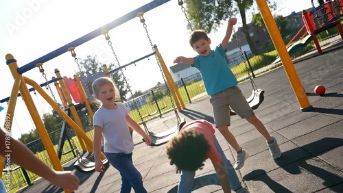 Joyful Children Playing Together in a Playground During Sunny Day