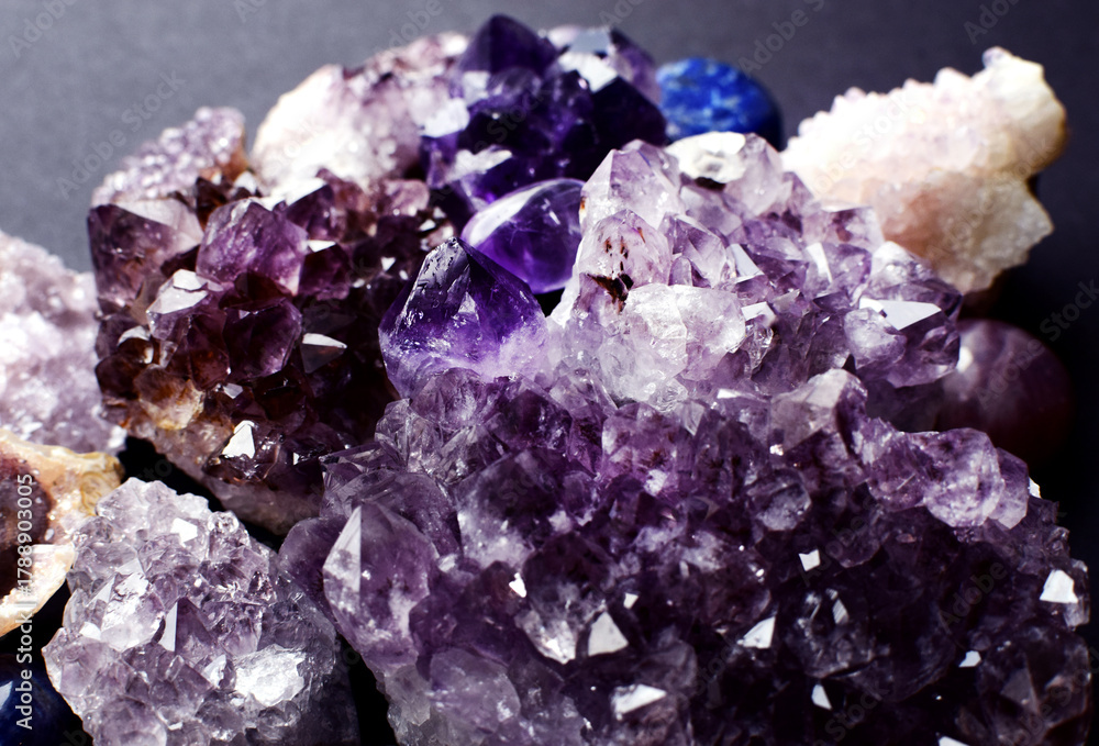 Fototapeta premium Beautiful purple amethyst druze of varying color saturation. Healing crystals.