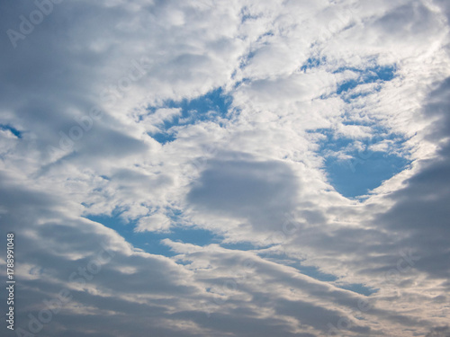 Made of clouds face in the sky