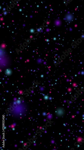 A vertical seamless loop of glowing neon particles floating in space, blending violet, cyan, and magenta lights on a black background for a dreamy cosmic effect