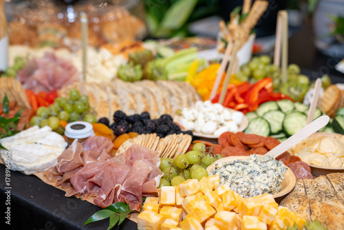 Large Charcuterie Board at an event with variety of finger foods