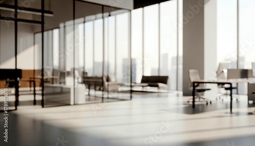 Bright blurred modern office interior with daylight and neutral tones. Contemporary workspace with structured lighting and clean design, suitable for business backgrounds.
