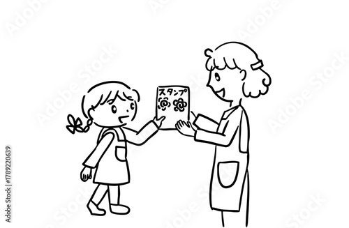 モノクロ、スタンプを先生からもらって喜ぶ子ども