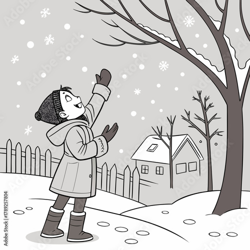 A child in winter clothing enjoying the snowfall outside his house