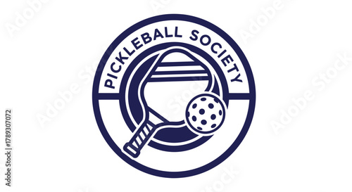 A circular dark blue logo for the Pickleball Society featuring a pickleball paddle and a pickleball inside the circle on a white background.