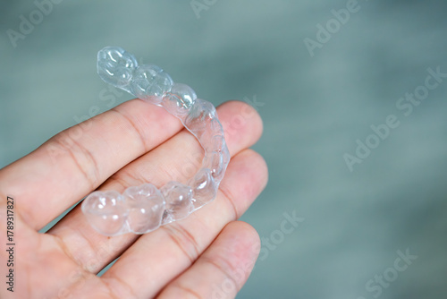 clear aligners device in the mouth on a white background. (invisalign)