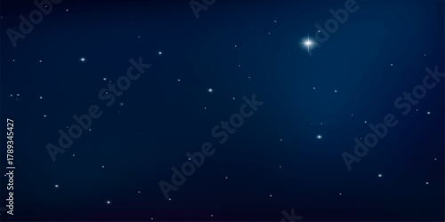 Abstract blue night sky with star particles glowing in the dark space of the galaxy universe background