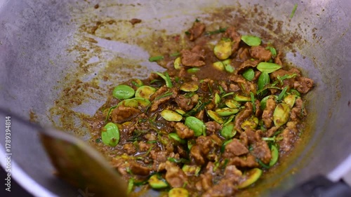 Spicy stir fried pork with Cluster Bean (Bitter Bean or stink beans) popular southern Thai food, Stir fried Stinky Bean in Chili Paste with Pork