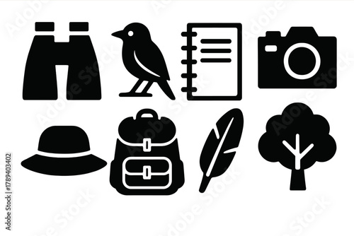 Birdwatching Icon Set. Birdwatching Essentials silhouette icon set: binoculars, bird silhouette, notebook, camera, hat, backpack, feather, tree.