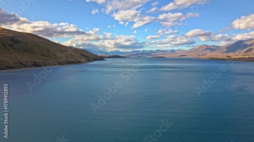 Wallpaper Mural Blue lake in New Zealand with mountains, clouds, and clear sky Torontodigital.ca