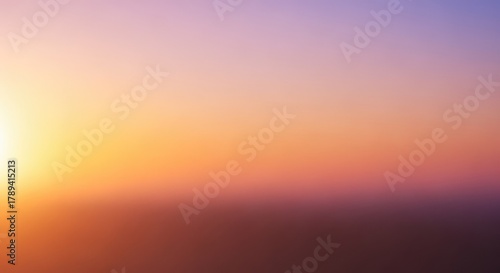 Vibrant sunset paints the sky with warm golden hues and soft purple gradients, creating a serene and breathtaking natural backdrop for peaceful reflection and inspiration.