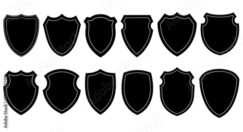 Collection of various black silhouette shield shapes isolated on white background