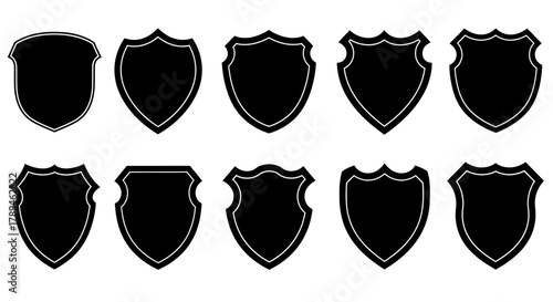 Collection of ten unique black shield silhouettes with distressed textures on a white background
