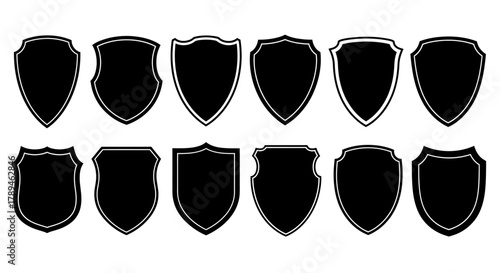 Collection of black silhouette medieval shields with textured edges on white background