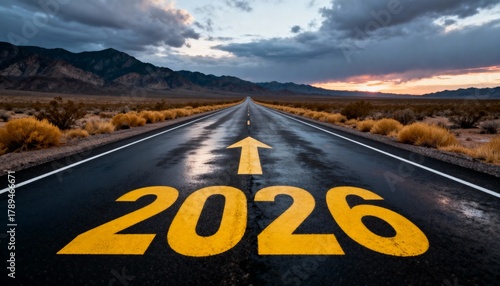 Straight road to 2026 with forward arrow at sunset