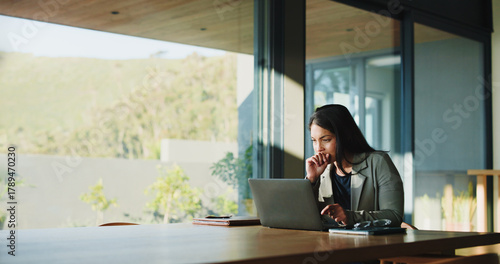 Attorney, woman or thinking with laptop in boardroom, legal research or lawsuit revision for labor law case. Justice, pc or lawyer with insight for dismissal dispute, assemble evidence or preparation