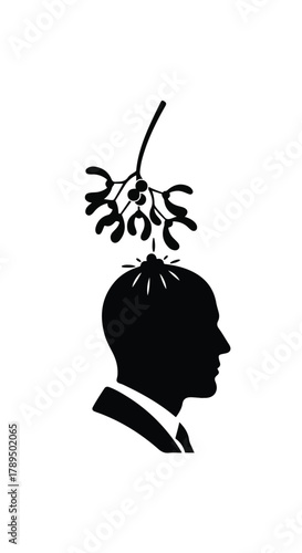 Man in profile under mistletoe, a festive holiday tradition