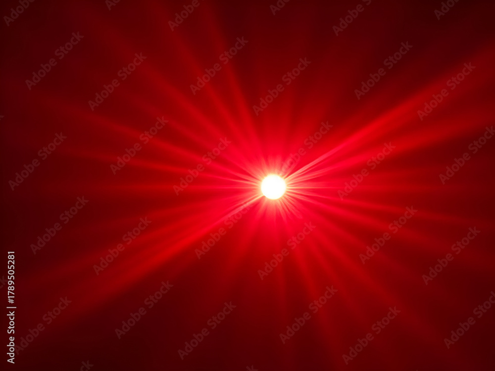 Obraz premium A brilliant, focused white light emitting sharp, intense red rays that radiate outwards against a deep crimson background