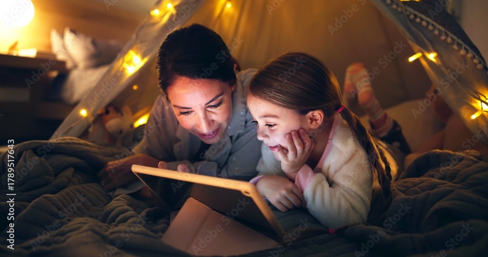 Naklejka premium Night, mother or child with tablet in fort for bonding together, reading ebook or bedtime story. Relax, parent or daughter with tech in home for online fairytale, kids storytelling app or literature.