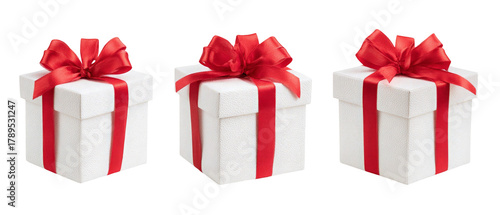 Wallpaper Mural Three elegantly wrapped presents with red ribbons, arranged in a row, set against a clean background, ideal for holiday promotions, gift-giving occasions, or festive celebrations Torontodigital.ca