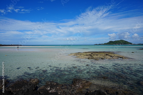 clear shoaling beach and people