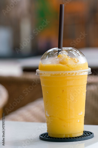 Healthy concept of drink through refreshing mango smoothies