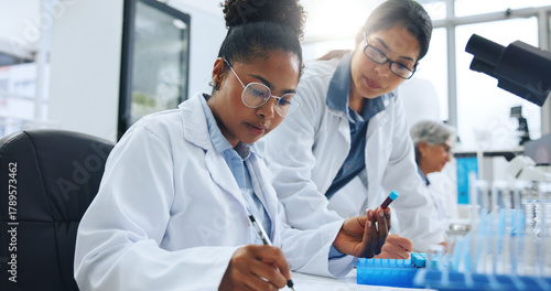 Fotografie Blood sample, writing and science with people in laboratory together for medical research