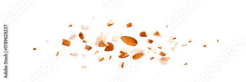 Crushed almonds falling isolated, flying nut pieces, levitate scattered almond seeds