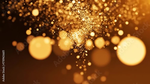 4K abstract cinemagraph of falling golden glitter and sparkling bokeh, festive background