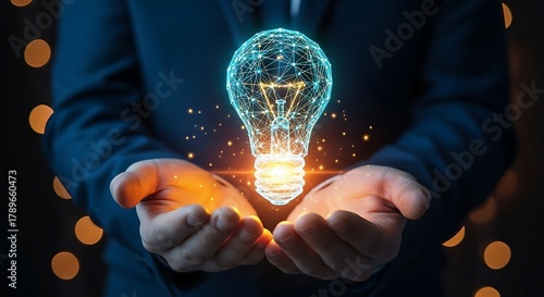 Businessman holding a glowing light bulb, symbolizing innovation and bright ideas in a dark setting.