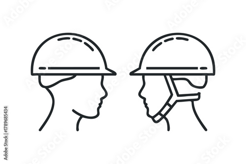 Two profiles wearing protective helmets facing each other