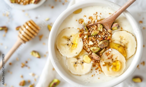 Banana yogurt bowl with granola and honey healthy breakfast food