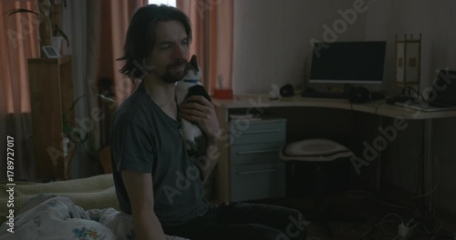 Man Waking up in Bed with Smartphone and Kitten. 4K 10-bit