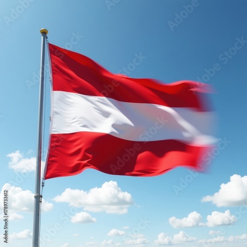 Free Download Austrian flag waving proudly on a flagpole against a blue sky with clouds - GFXLoad