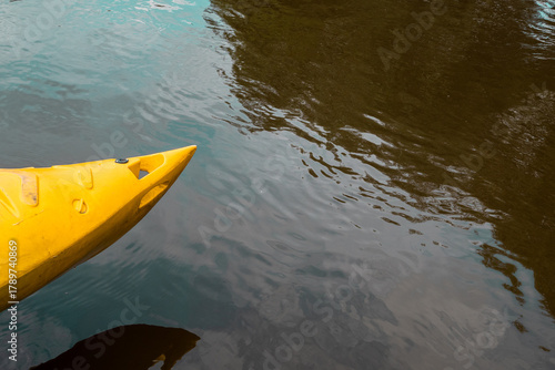 yellow kayak on a river - summer daytrip adventure