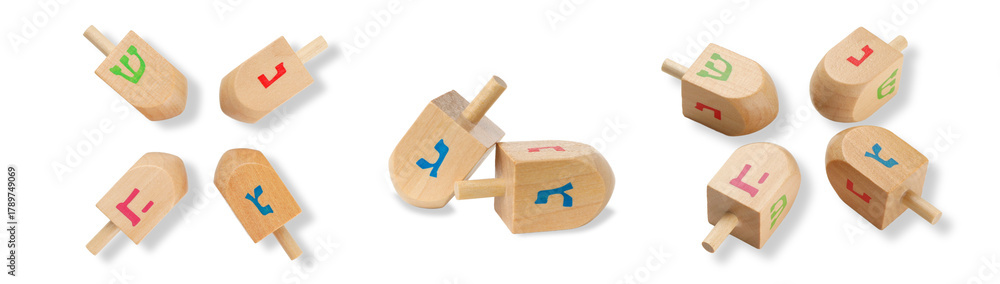 Fototapeta premium Colorful dreidels spinning on white background, isolated, PNG