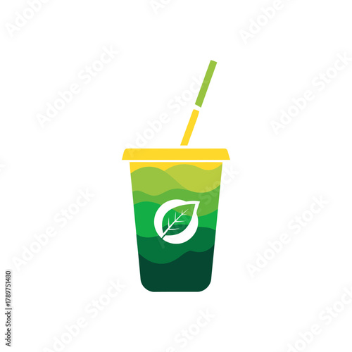 Green smoothie in a yellow cup with a straw represents healthy eating and a sustainable lifestyle choice.