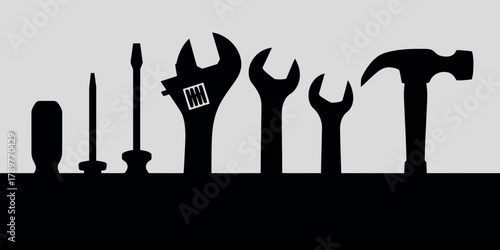 Silhouette of various hand tools arranged in a line