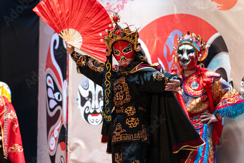 Chinese actor performs a public traditional changing face performance onstage in Chengdu, China