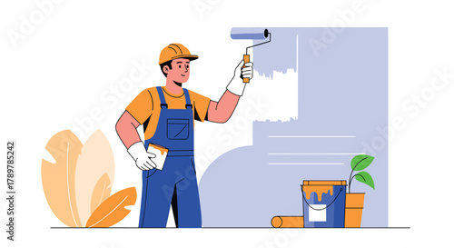A skilled male painter in a hard hat and overalls applies light blue paint to a wall with a roller, ready for home renovation or decoration.