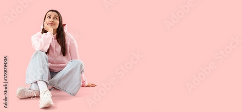 Thoughtful young woman on p...