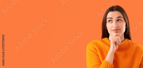 Thoughtful young woman on o...