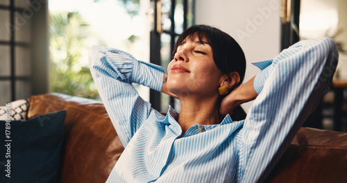 Принти на полотні Smile, stretching and woman with relax on sofa for weekend break, peaceful morning and mindfulness