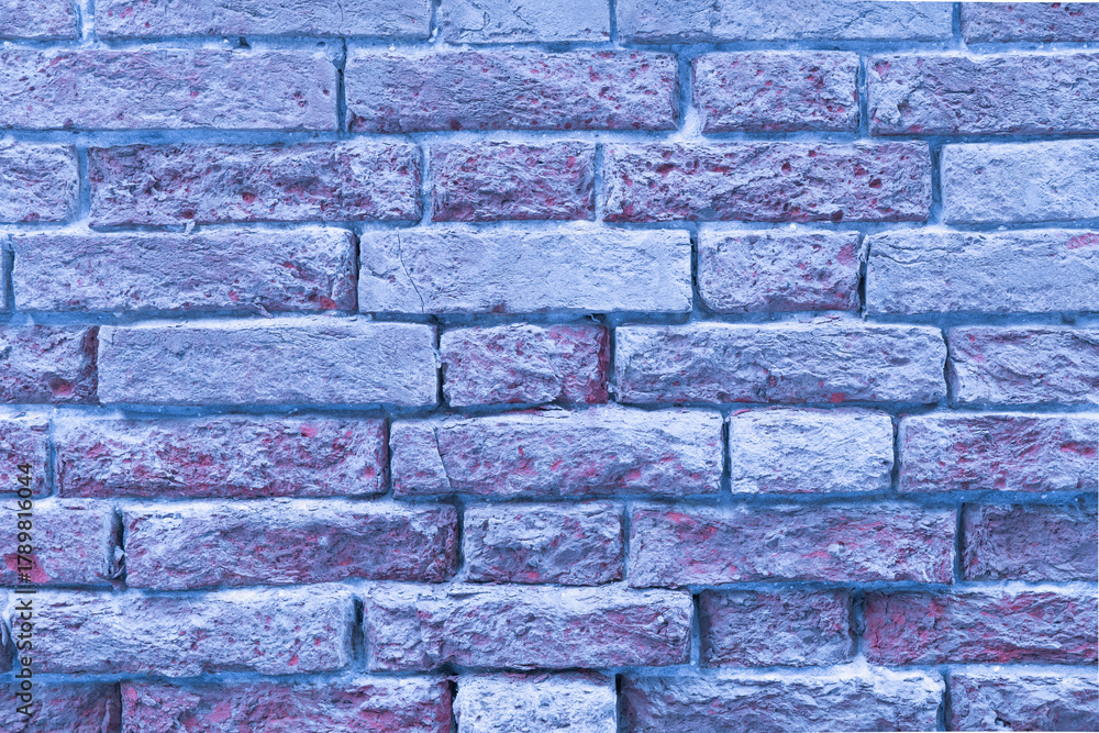 Fototapeta premium Textured blue brick wall with varying shades and patterns providing a unique urban backdrop in a modern setting