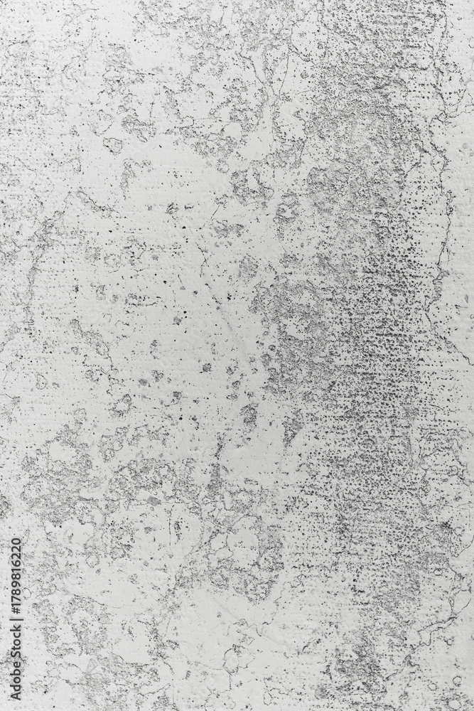 Fototapeta premium Abstract textured surface with gray and white patterns showing wear and age