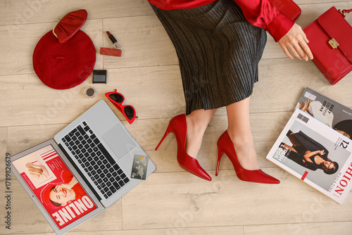 Stylish woman with laptop a...