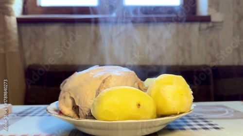 Homemade chicken and potatoes, steam from freshly cooked hot chicken, healthy and wholesome food, self-care. High quality