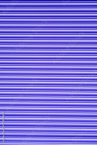 Purple painted shutter in front of closed shop