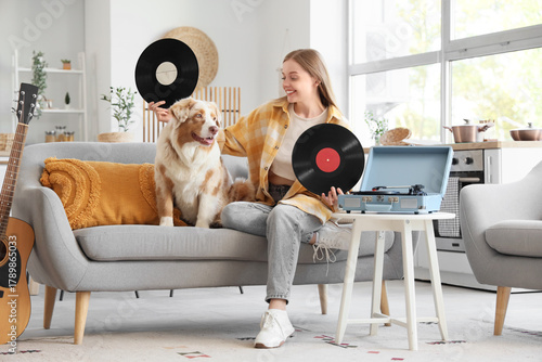 Young woman with vinyl disk...